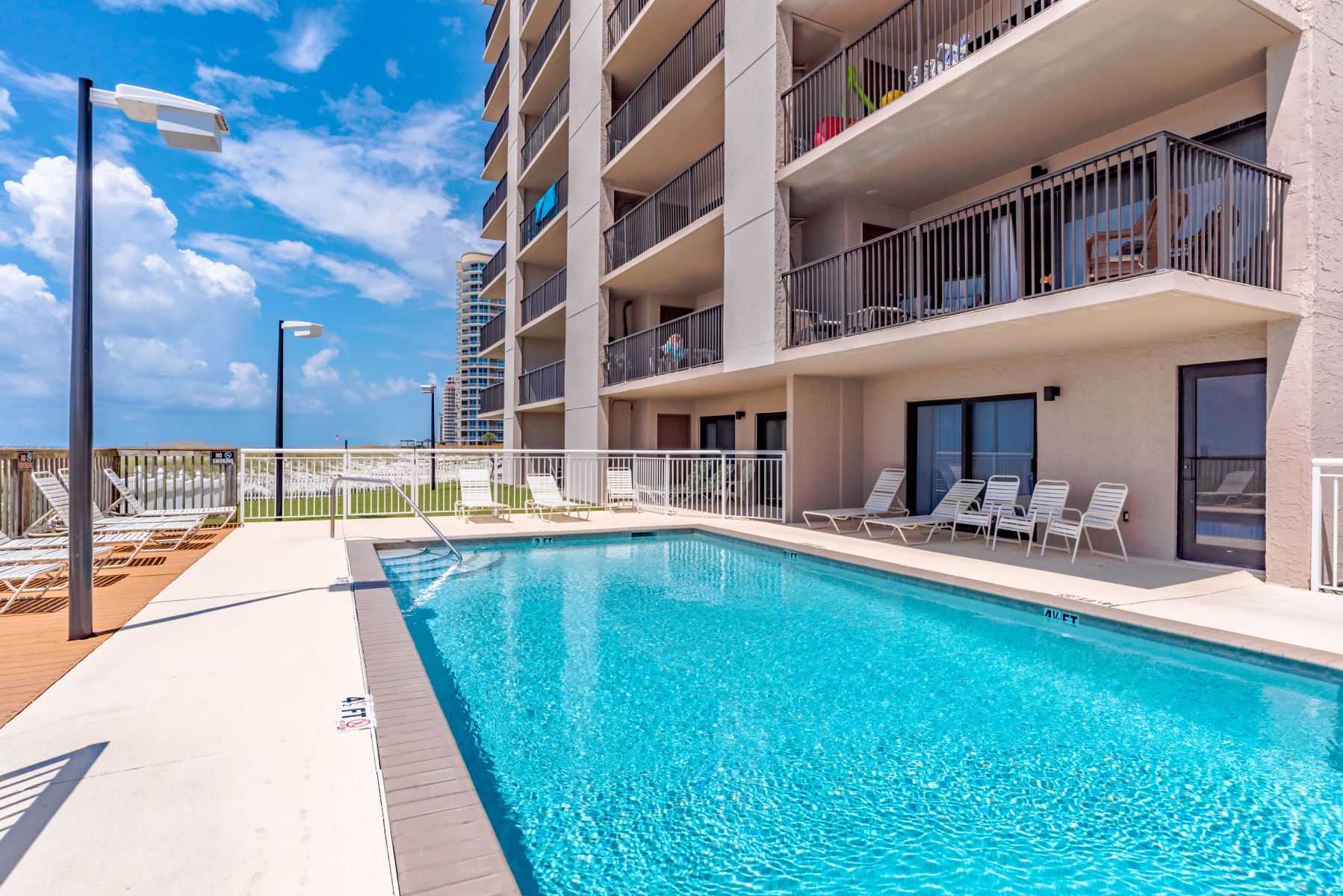 Ocean Breeze East Condos Pool Deck And Chairs
