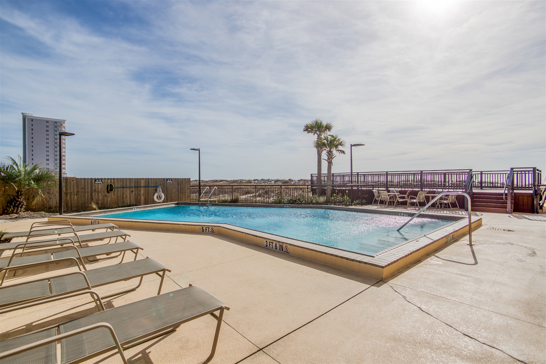 Ocean Breeze West Condos Pool And Chairs