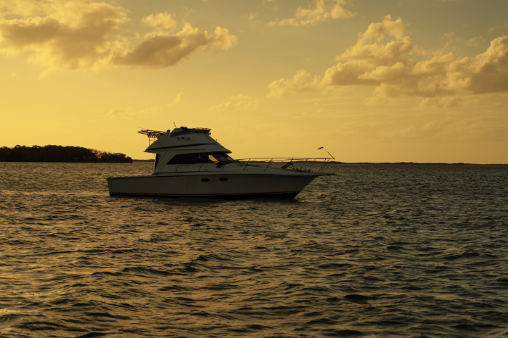 Boat on the Ocean at Sunset