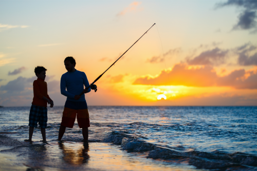 Kids Fishing on Beach at Sunset